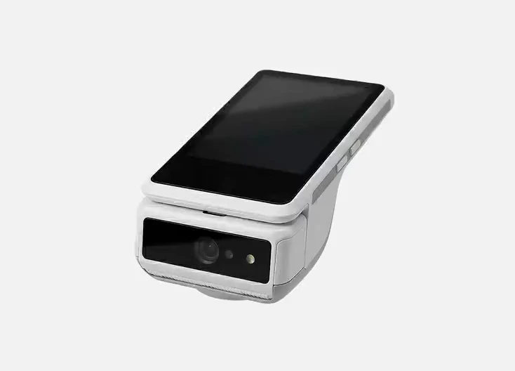 The Payable PRO terminal, turning to show its screen and its scanner.